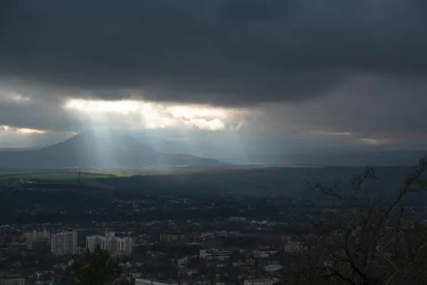 Movement of clouds over the city and mountain peaks Stock Footage 306302036
