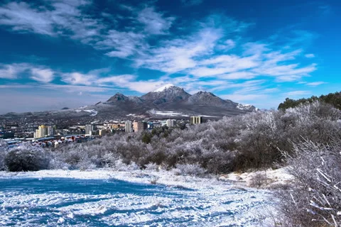Movement of clouds over the city and mountain peaks Stock Footage 306302169