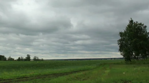 Movement of clouds over a dirt road. Ishimsky district, Tyumen region, Russia,  Stock Footage 57395649