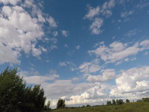 The movement of clouds over the field Stock Footage 78157817