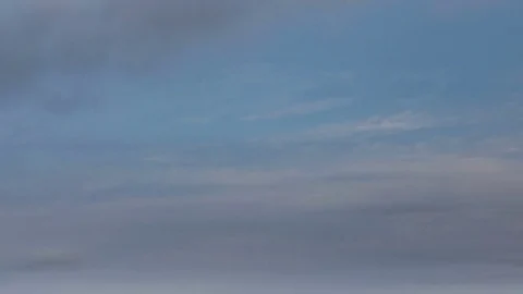 The movement of the clouds over the fields of winter wheat in spring in steppes Stock Footage 73940338