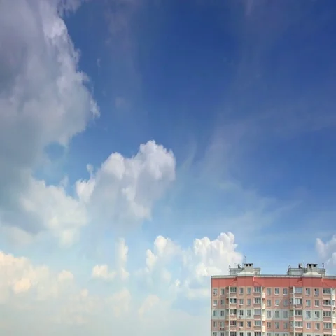 Movement of clouds over the forest, high-rise building, time-lapse Stock Footage 69530887