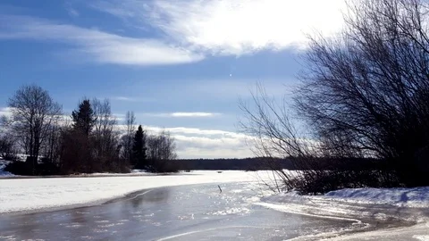 The movement of the clouds over the frozen river Stock-Footage 74053224