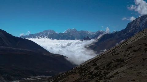 The movement of clouds over the highland valley Stock Footage 84675598