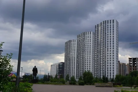 The movement of clouds over houses during the day in the park Stock Footage 201241858