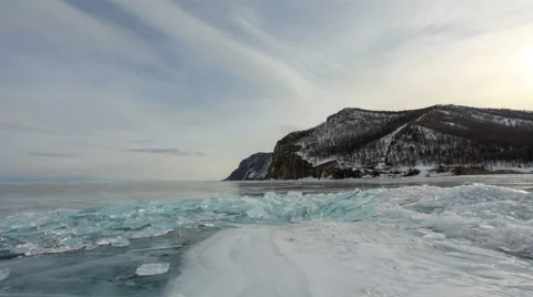 Movement of the clouds over the icy Lake Baikal on Olkhon Island, Lake Baikal,  Stock Footage 64946577