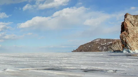 Movement of the clouds over the icy Lake Baikal on Olkhon Island, Irkutsk region Stock Footage 65247708