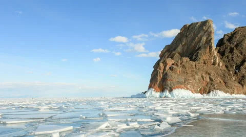 Movement of the clouds over the icy Lake Baikal on Olkhon Island, Irkutsk region Stock Footage 65247778