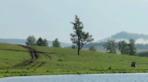 Movement of the clouds over the lake Agaskyr, Kostino village.  Stock Footage 59791730
