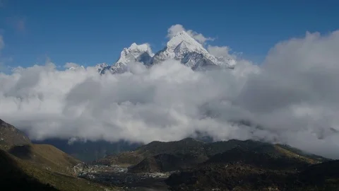The movement of clouds over the mountain Kangtega Stock Footage 82636224