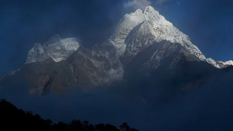 The movement of clouds over the mountain Kangtega Stock Footage 82816982