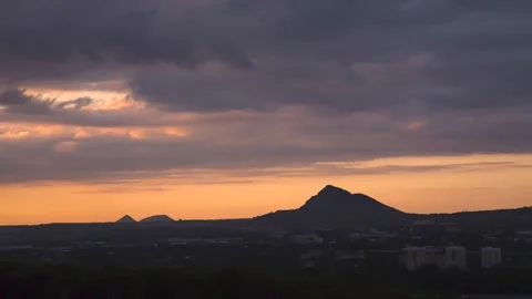 The movement of clouds over a mountain peak Stock Footage 151426541