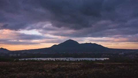 The movement of clouds over a mountain peak Stock Footage 151426594