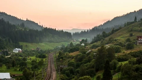 The movement of clouds over the mountains with trees, the movement of the trains 動画素材 73924481