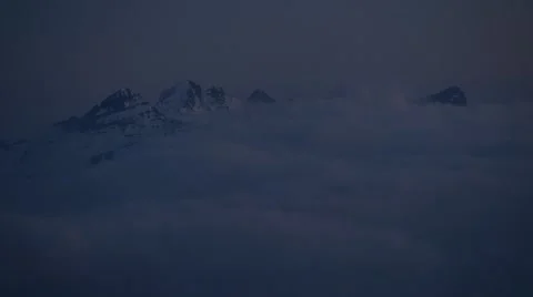 Movement of clouds over the peaks of the Alps Stock Footage 61819676