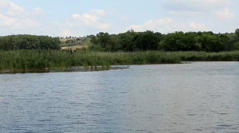 Movement of clouds over the river. Donetsk region, Ukraine, FULL HD Stock Footage 34437645
