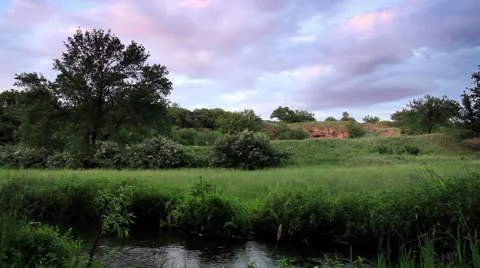Movement of clouds over the river.  Stock Footage 24978773