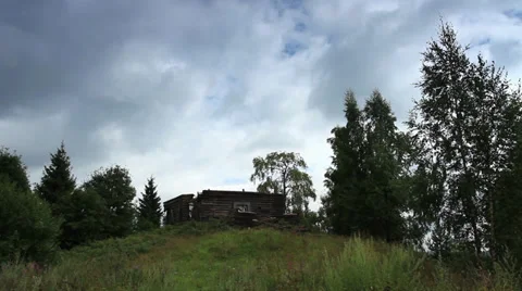 Movement of clouds over the ruins of the old Russian wooden church. Moiseevichi, Stock Footage 29680408