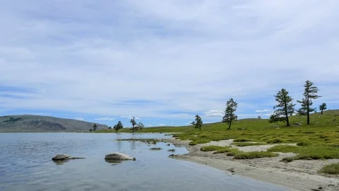 Movement of the clouds over the salted lake Khoton Nuur, Mongolia.  Stock Footage 77255905