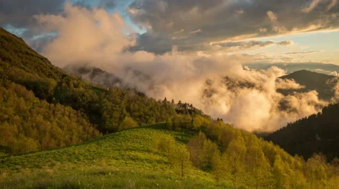 Movement of clouds over the summer slopes of Caucasus Mountains 動画素材 67252537