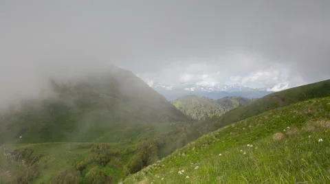Movement of clouds over the summer slopes of Caucasus Mountains Stock-Footage 67253489