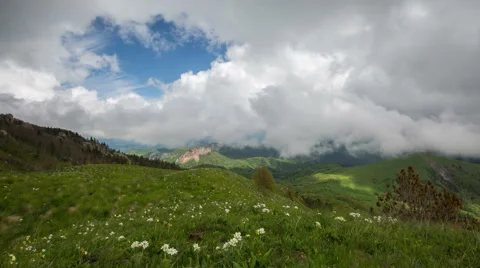 Movement of clouds over the summer slopes of Caucasus Mountains Stock-Footage 67253756