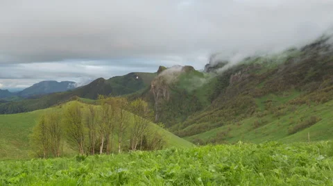 Movement of clouds over the summer slopes of Caucasus Mountains Stock-Footage 67254517