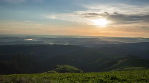 Movement of clouds over the summer slopes of Caucasus Mountains 動画素材 67264982