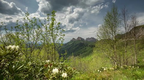 Movement of clouds over the summer slopes of Caucasus Mountains 動画素材 67275238
