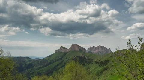 Movement of clouds over the summer slopes of Caucasus Mountains Stock-Footage 67275480