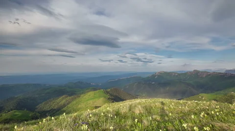 Movement of clouds over the summer slopes of Caucasus Mountains 動画素材 67281641