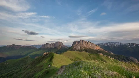Movement of clouds over the summer slopes of Caucasus Mountains 動画素材 67283589