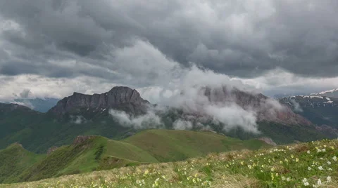 Movement of clouds over the summer slopes of Caucasus Mountains 스톡 동영상 67306495