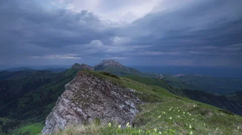 Movement of clouds over the summer slopes of Caucasus Mountains Видео 67307333