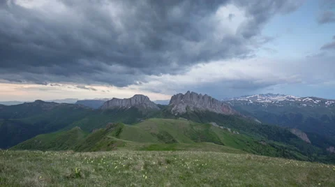 Movement of clouds over the summer slopes of Caucasus Mountains Видео 67307574