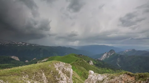 Movement of clouds over the summer slopes of Caucasus Mountains Stock Footage 67307754