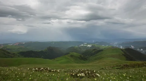 Movement of clouds over the summer slopes of Caucasus Mountains Stock Footage 67308270