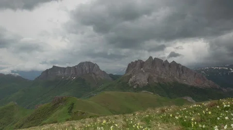 Movement of clouds over the summer slopes of Caucasus Mountains Stock Footage 67308365