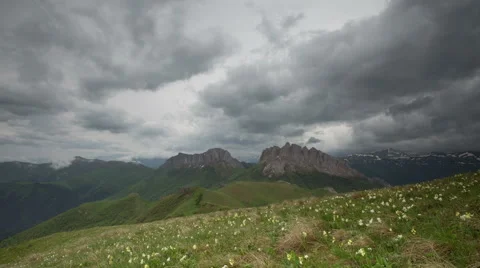 Movement of clouds over the summer slopes of Caucasus Mountains Stock Footage 67308612