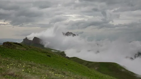 Movement of clouds over the summer slopes of Caucasus Mountains Stock Footage 67328527