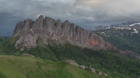 Movement of clouds over the summer slopes of Caucasus Mountains Stock Footage 67328970
