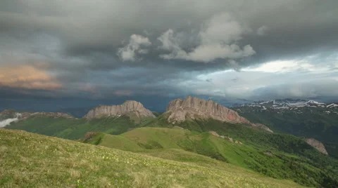Movement of clouds over the summer slopes of Caucasus Mountains Stock Footage 67330830