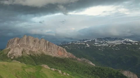 Movement of clouds over the summer slopes of Caucasus Mountains Stock Footage 67330951