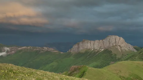 Movement of clouds over the summer slopes of Caucasus Mountains Stock Footage 67331080
