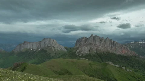 Movement of clouds over the summer slopes of Caucasus Mountains Stock Footage 67331977