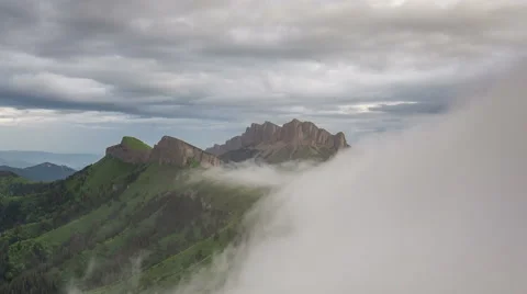 Movement of clouds over the summer slopes of Caucasus Mountains Stock Footage 67333997