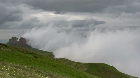 Movement of clouds over the summer slopes of Caucasus Mountains Stock Footage 67335284