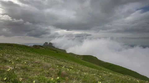 Movement of clouds over the summer slopes of Caucasus Mountains Stock Footage 67335504