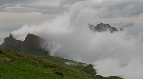 Movement of clouds over the summer slopes of Caucasus Mountains Stock Footage 67335594
