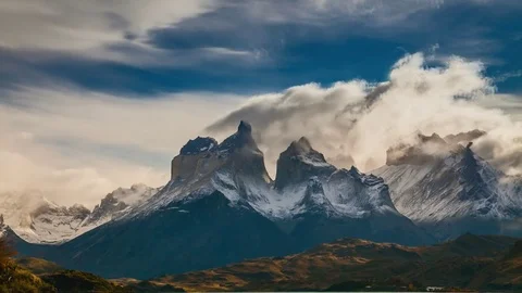 The movement of clouds over the towers of Cuernos. Parque Torres del Paine Stock Footage 75821640
